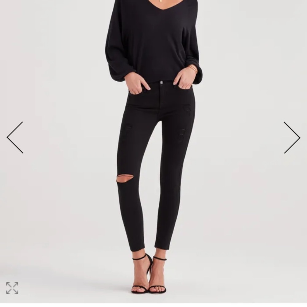 distressed black jeans